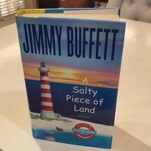 Jimmy Buffett, a salty piece of land hardback first edition with CD